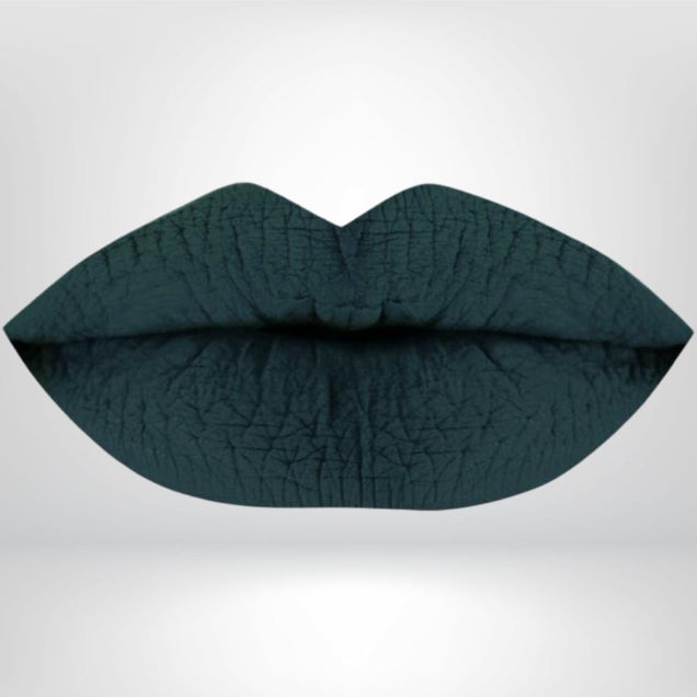 A dark green, high-pigment matte lipstick with bold color and a smooth matte finish. 