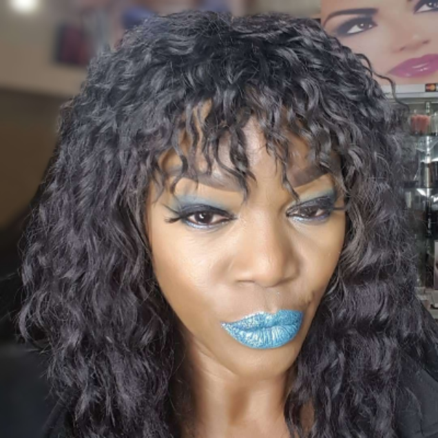 Model wearing light blue, high-pigment cream lipstick with bold color and a smooth creamy finish.