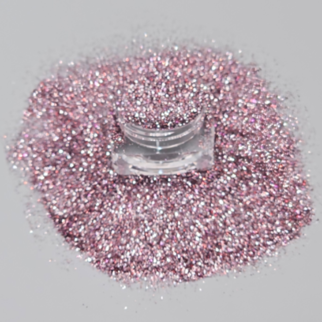 An ultra-fine baby pink cosmetic grade glitter for eye makeup, face and body with a high-impact shimmer. 